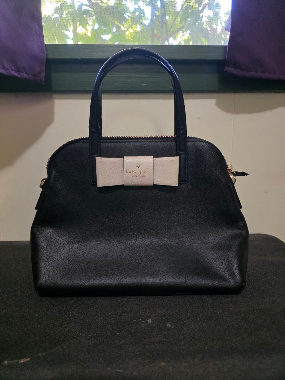 kate spade black leather satchel with cream bow accent
